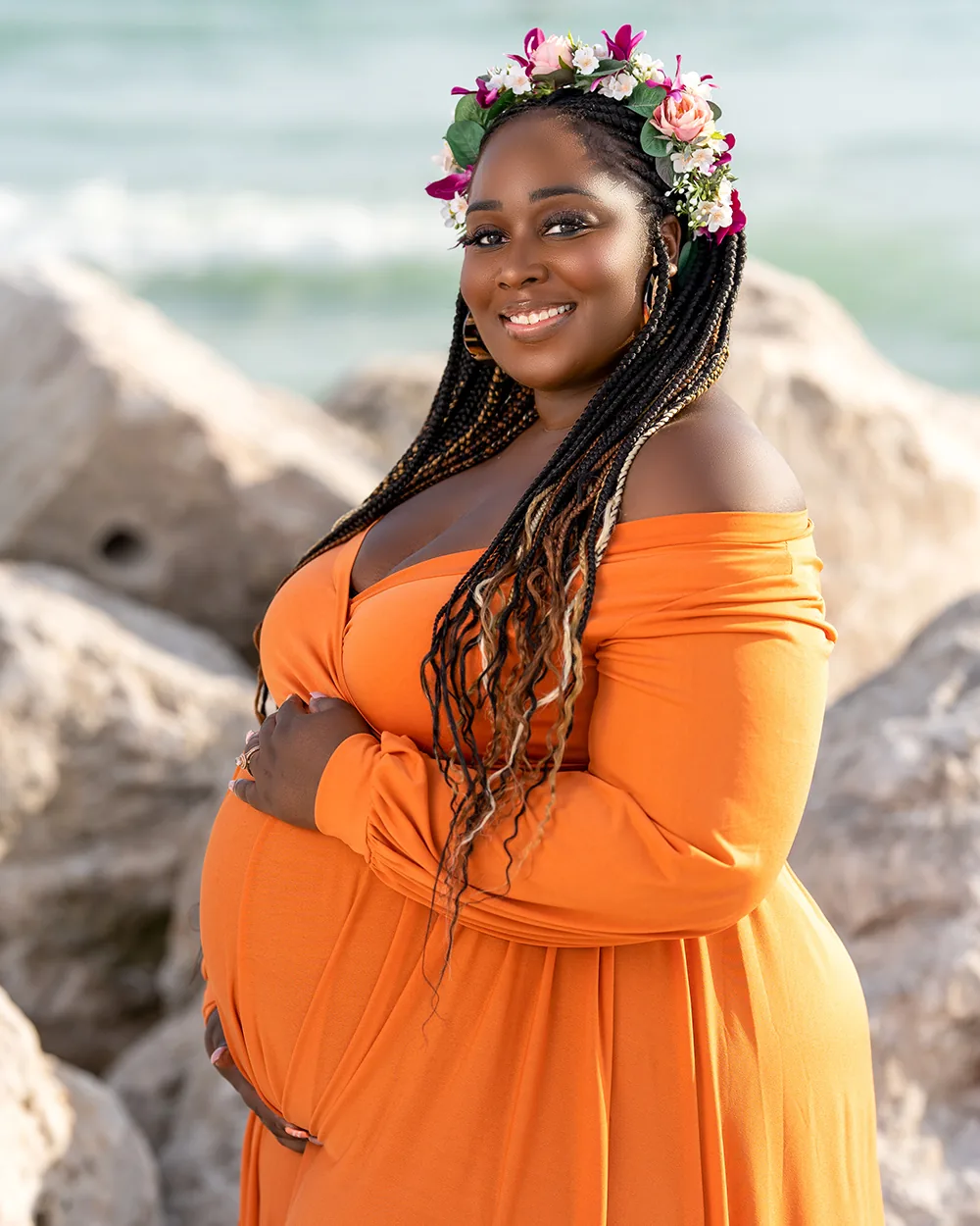 Maternity photographer Tampa FL orange gown flower crown on the rocks